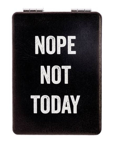 Black rectangular object with 'NOPE NOT TODAY' text on a white background