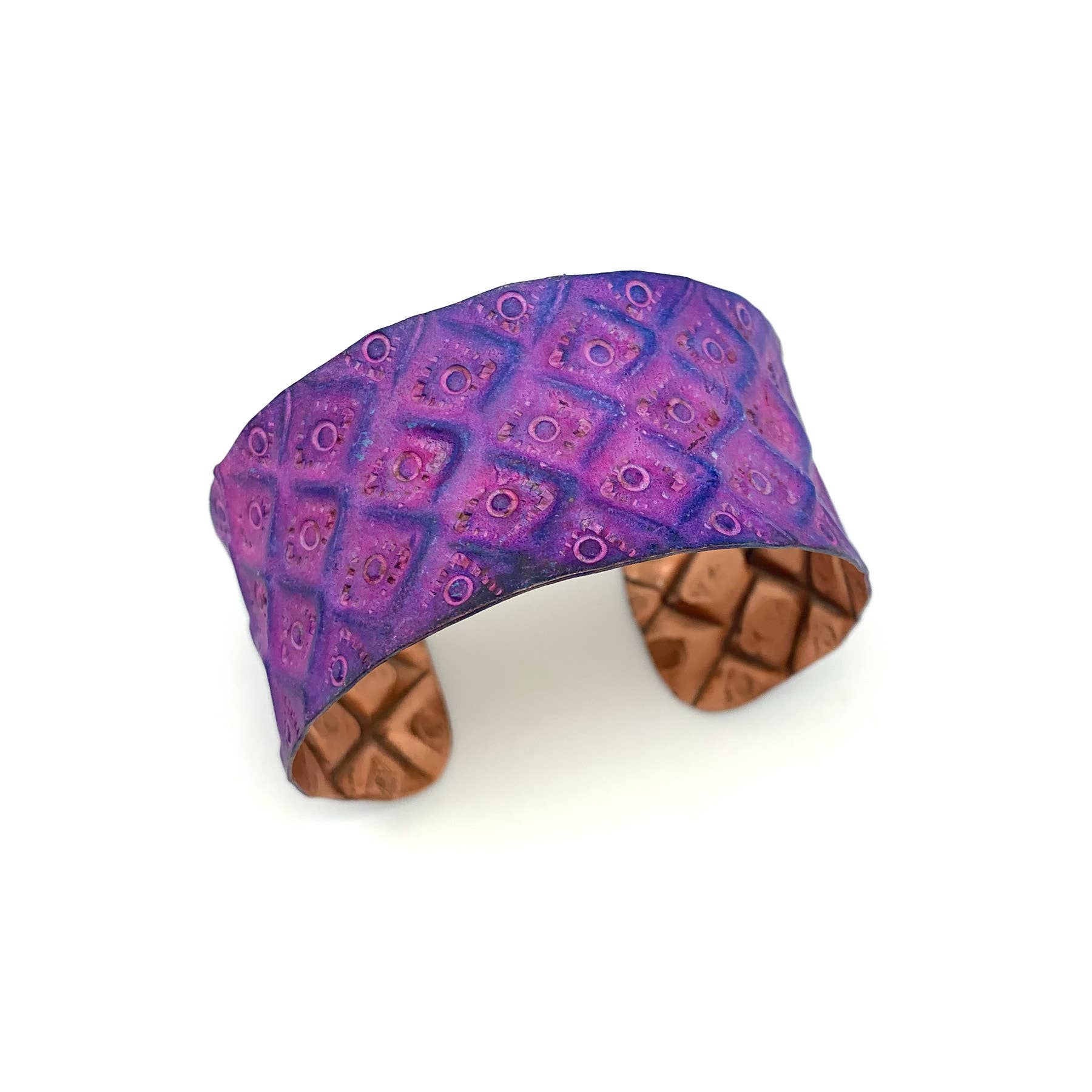 Cuff bracelet with purple patterned band and wooden texture on a white background