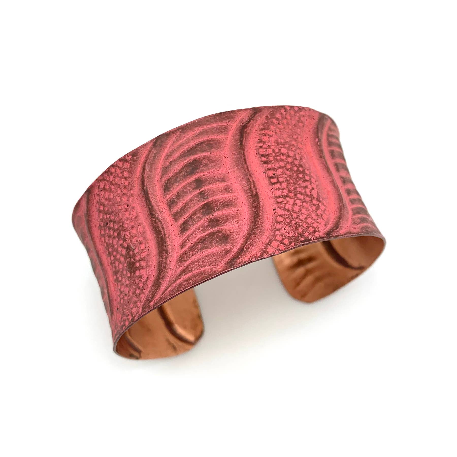 Coral Copper bracelet with leaf pattern on a white background