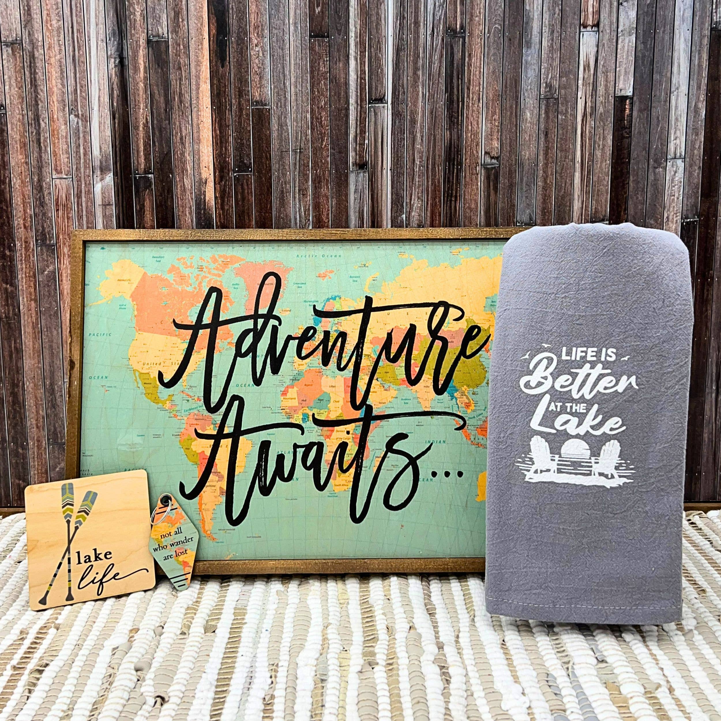 Life is better at the lake items in an assorted layout with wooden background