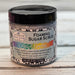 Crystal Energy Foaming sugar scrub container with decorative label on a wooden surface
