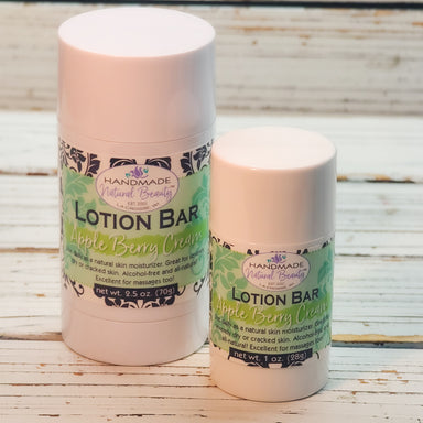 Two lotion bars with 'Handmade Natural Beauty' labels on a wooden surface
