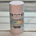 Lotion bar with a colorful label on a wooden surface