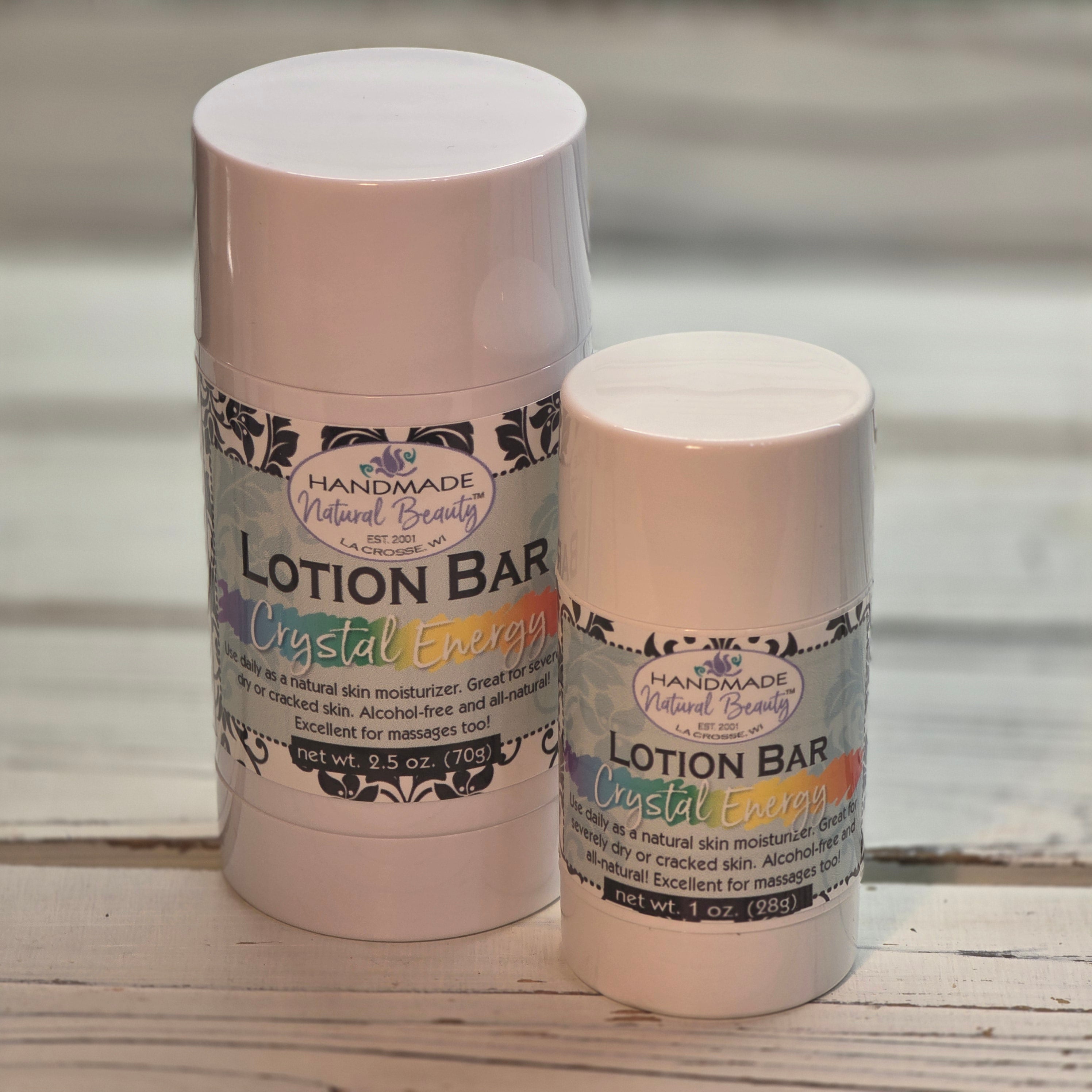 Crystal Energy Two lotion bars with labels on a wooden surface