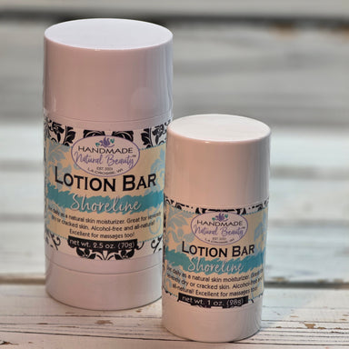 Two lotion bars with decorative labels on a wooden surface scented Shoreline
