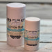 Two lotion bars with decorative labels on a wooden surface scented Shoreline
