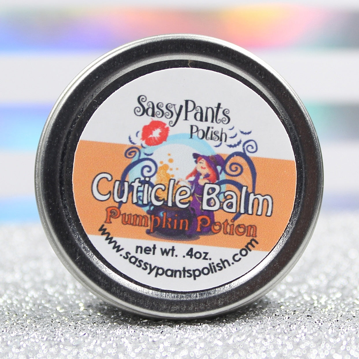 A cuticle balm with witch artwork in the scent pumpkin potion by Sassy Pants Polish