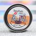A cuticle balm with witch artwork in the scent pumpkin potion by Sassy Pants Polish