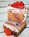 Orange purple and white swirled goat milk soap by Handmade Natural Beauty featuring various shapes of autumn leaves glycerin soaps on top.