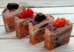 Orange purple and white swirled goat milk soap by Handmade Natural Beauty featuring various shapes of autumn leaves glycerin soaps on top.